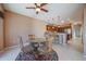 Cozy breakfast nook with glass-top table and patio access at 19403 N Ponderosa Ct, Surprise, AZ 85387