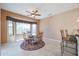 Bright breakfast nook with a round glass table and four chairs at 19403 N Ponderosa Ct, Surprise, AZ 85387