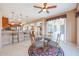 Breakfast nook with glass table, chairs, and access to back patio at 19403 N Ponderosa Ct, Surprise, AZ 85387