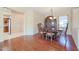 Elegant dining room with hardwood floors and a large china cabinet at 19403 N Ponderosa Ct, Surprise, AZ 85387