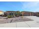 House exterior with two-car garage and desert landscaping at 19403 N Ponderosa Ct, Surprise, AZ 85387