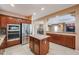 Well-equipped kitchen with granite counters and microwave at 19403 N Ponderosa Ct, Surprise, AZ 85387