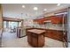 Spacious kitchen with island and stainless steel appliances at 19403 N Ponderosa Ct, Surprise, AZ 85387