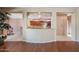 Kitchen features a breakfast bar and views into adjacent dining area at 19403 N Ponderosa Ct, Surprise, AZ 85387