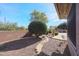 Landscaped backyard with gravel pathway and desert plants at 19403 N Ponderosa Ct, Surprise, AZ 85387