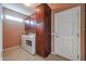 Laundry room with washer, dryer, and cabinets at 19403 N Ponderosa Ct, Surprise, AZ 85387