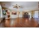 Open concept living area with hardwood floors and a ceiling fan at 19403 N Ponderosa Ct, Surprise, AZ 85387