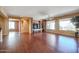 Living room with hardwood floors and large windows at 19403 N Ponderosa Ct, Surprise, AZ 85387