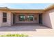 Covered patio with flagstone flooring and sliding glass doors at 19403 N Ponderosa Ct, Surprise, AZ 85387