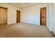 Spacious bedroom with carpet flooring and access to a bathroom at 3614 W Krall St, Phoenix, AZ 85019