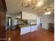 Open kitchen featuring an island with stone countertop, cabinets, and appliances at 3614 W Krall St, Phoenix, AZ 85019