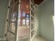 View of living room with tile floors, ceiling fan, and neutral paint, as seen through open doors at 3614 W Krall St, Phoenix, AZ 85019