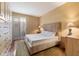Bright bedroom with large bed, built-in wardrobe, and patio access at 6334 N 19Th St, Phoenix, AZ 85016