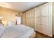 Spacious bedroom with large built-in wardrobe and hardwood floors at 6334 N 19Th St, Phoenix, AZ 85016