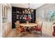 Charming dining area with a round table and built-in shelves at 6334 N 19Th St, Phoenix, AZ 85016
