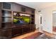 Home entertainment center with large TV and built-in shelving at 6334 N 19Th St, Phoenix, AZ 85016