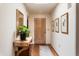 Bright entryway with hardwood floors and a tasteful console table at 6334 N 19Th St, Phoenix, AZ 85016