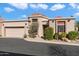 Tan two-story home with tile roof and attached garage at 6334 N 19Th St, Phoenix, AZ 85016