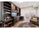 Home office features built-in shelving, a desk, and French doors leading to a patio at 6334 N 19Th St, Phoenix, AZ 85016