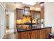 Kitchen with granite island, custom cabinetry, and a gas cooktop at 6334 N 19Th St, Phoenix, AZ 85016