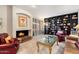Spacious living room featuring a fireplace, built-in shelves, and comfortable seating at 6334 N 19Th St, Phoenix, AZ 85016
