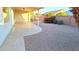 Landscaped backyard with gravel and a covered patio at 8053 E Natal Ave, Mesa, AZ 85209