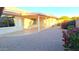 Spacious backyard with covered patio, gravel landscaping, and mature shrubs at 8053 E Natal Ave, Mesa, AZ 85209