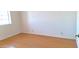 Bright bedroom with hardwood floors and a window at 8053 E Natal Ave, Mesa, AZ 85209