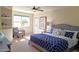 Main bedroom with plush carpeting and access to a private patio at 8053 E Natal Ave, Mesa, AZ 85209