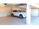 Two-car garage with epoxy floors and extra storage at 8053 E Natal Ave, Mesa, AZ 85209