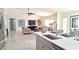 Open concept kitchen with island, stainless steel appliances and breakfast bar at 8053 E Natal Ave, Mesa, AZ 85209