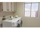 Bright laundry room with washer and dryer hookups at 8053 E Natal Ave, Mesa, AZ 85209