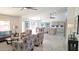 Open concept living room and kitchen with tile flooring and high ceilings at 8053 E Natal Ave, Mesa, AZ 85209