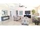 Spacious living room with tile flooring, comfortable seating, and large windows at 8053 E Natal Ave, Mesa, AZ 85209