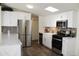 Bright kitchen with stainless steel appliances and white cabinets at 11275 N 99Th Ave # 14, Peoria, AZ 85345