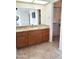 Bathroom with granite vanity and ample storage at 8203 E Nopal Ave, Mesa, AZ 85209