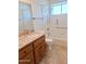 Bathroom with granite countertop vanity and bathtub at 8203 E Nopal Ave, Mesa, AZ 85209
