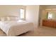 Bright bedroom with a queen-size bed and ensuite bathroom at 8203 E Nopal Ave, Mesa, AZ 85209