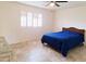 Bright bedroom with tiled floor and large window at 8203 E Nopal Ave, Mesa, AZ 85209