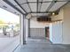 Attached garage with built-in cabinets and refrigerator at 8203 E Nopal Ave, Mesa, AZ 85209