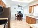 Open kitchen with breakfast nook and stainless steel appliances at 8203 E Nopal Ave, Mesa, AZ 85209