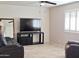 Relaxing living room with large TV and comfortable seating at 8203 E Nopal Ave, Mesa, AZ 85209