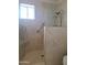 Walk-in shower with tiled walls and built-in seat at 8203 E Nopal Ave, Mesa, AZ 85209