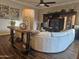 Elegant living room featuring a stylish sofa, entertainment center, and sleek hardwood flooring at 2299 E Saddlebrook Rd, Gilbert, AZ 85298