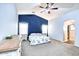 Spacious bedroom with carpeted floor, ceiling fan, and ensuite bathroom access at 775 E Leslie Ave, San Tan Valley, AZ 85140
