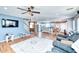Open concept living room with hardwood floors and ceiling fan at 775 E Leslie Ave, San Tan Valley, AZ 85140
