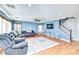 Spacious living room with hardwood floors and a view to the kitchen at 775 E Leslie Ave, San Tan Valley, AZ 85140