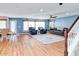 Relaxing living room, hardwood floors, and blue walls at 775 E Leslie Ave, San Tan Valley, AZ 85140