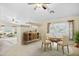 A dining room features a round table, stylish chairs, and a decorative rug at 15758 W Edgemont Ave, Goodyear, AZ 85395