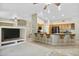 Open kitchen with island seating, stainless appliances, and ample cabinet space at 15758 W Edgemont Ave, Goodyear, AZ 85395